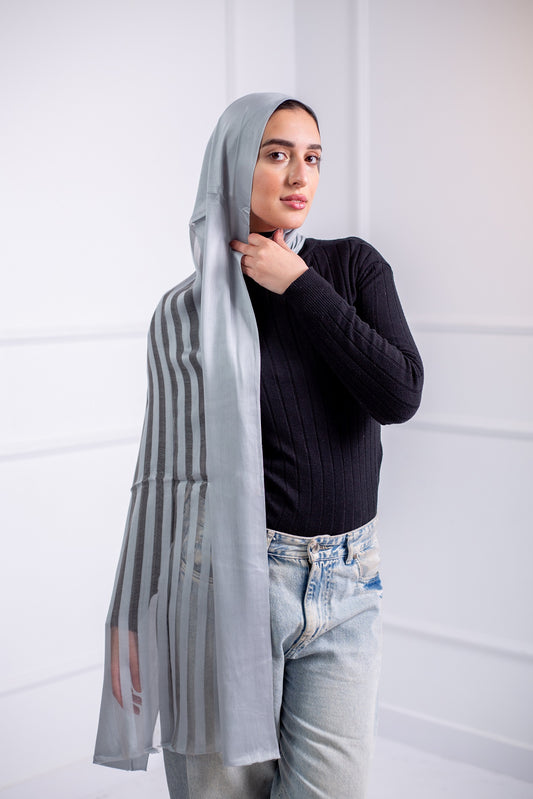 Silky Silver long hijab with line design, worn with casual jeans and a black top – back view.