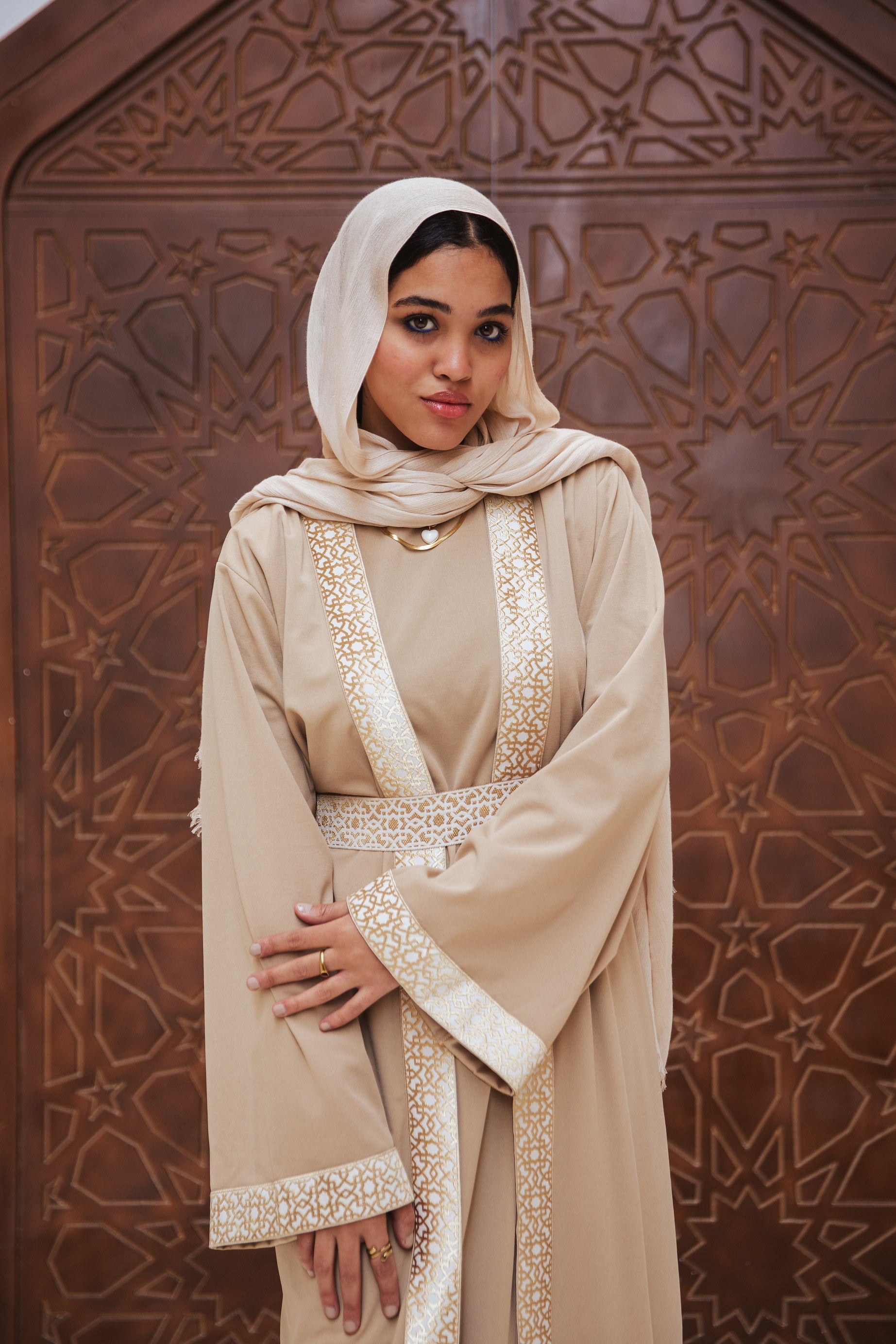 Horya Kaftan Beige Crafted from scuba fabric, its flowing design drapes beautifully, while the belt adds definition, creating a timeless and feminine silhouette.