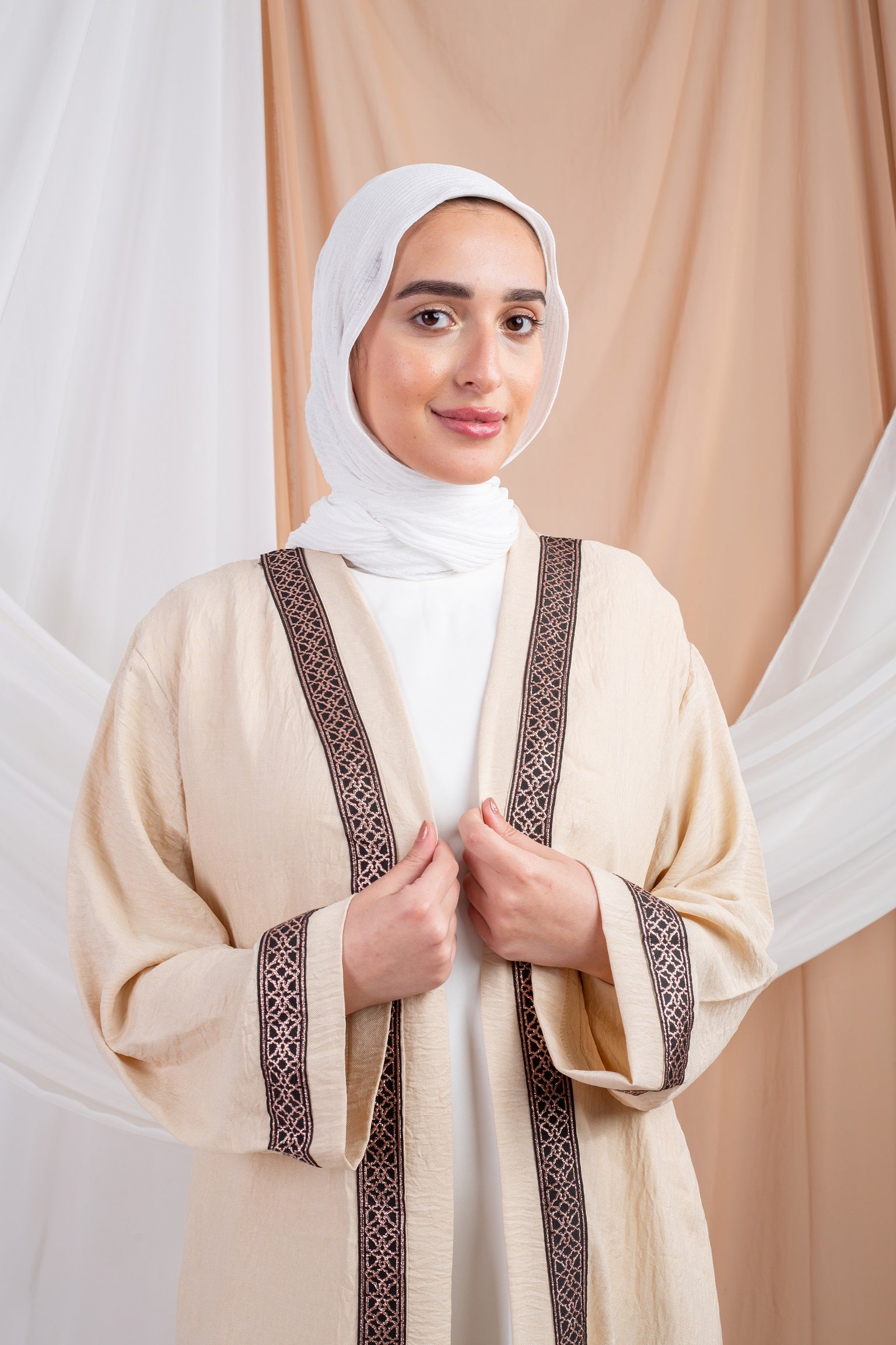 Hosn Kaftan Beige is  linen fabric provides a sleek, polished look,allowing for effortless movement and timeless charm.