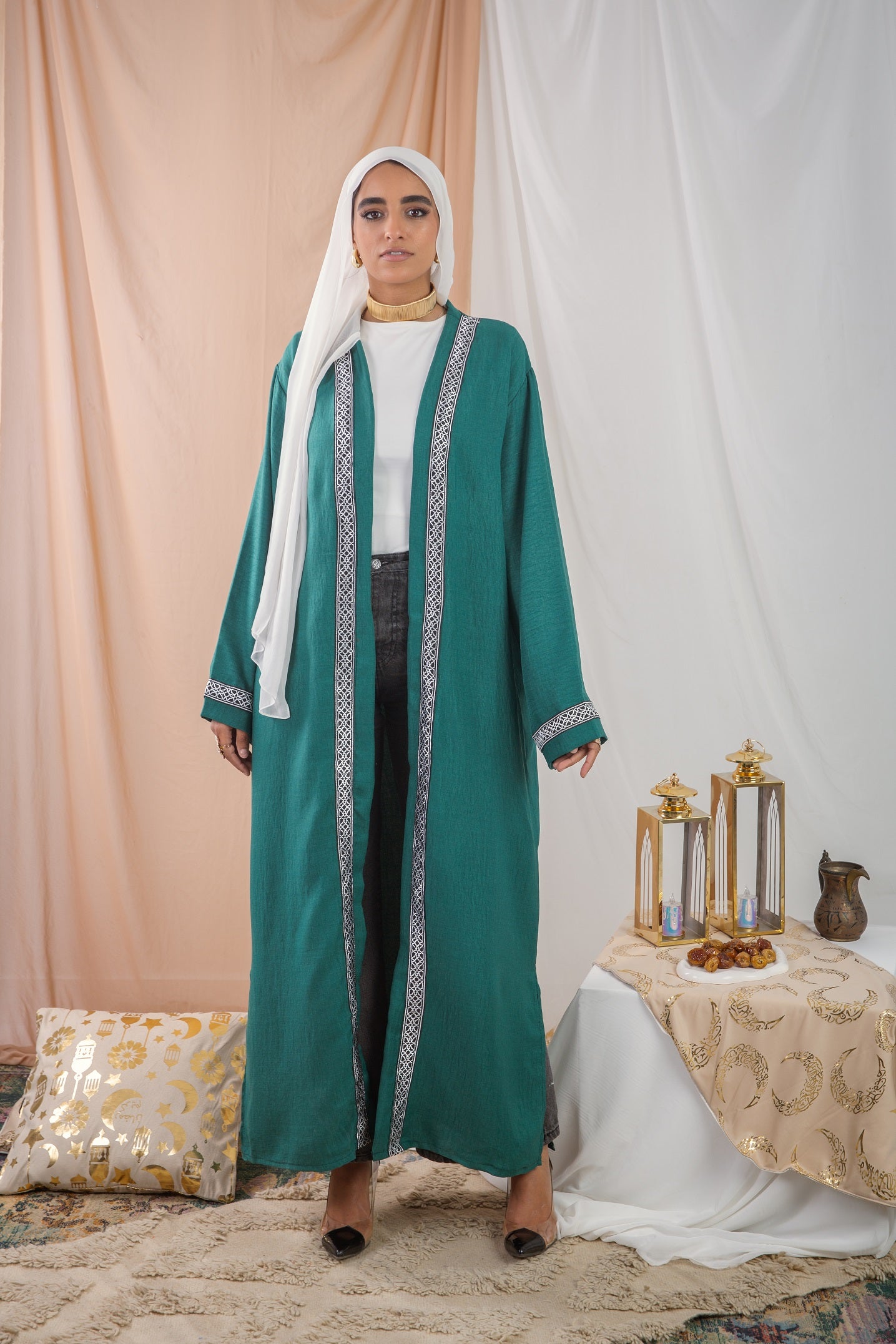 Hosn Kaftan Dark Green is  linen fabric provides a sleek, polished look,allowing for effortless movement and timeless charm.