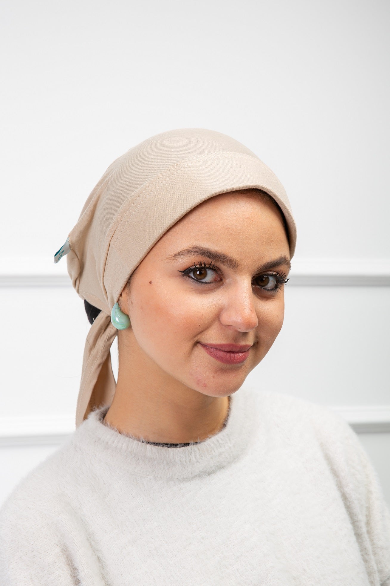 Front Support Ribbon Bonnet in beige with smooth fit and ribbon detail from Velda Store