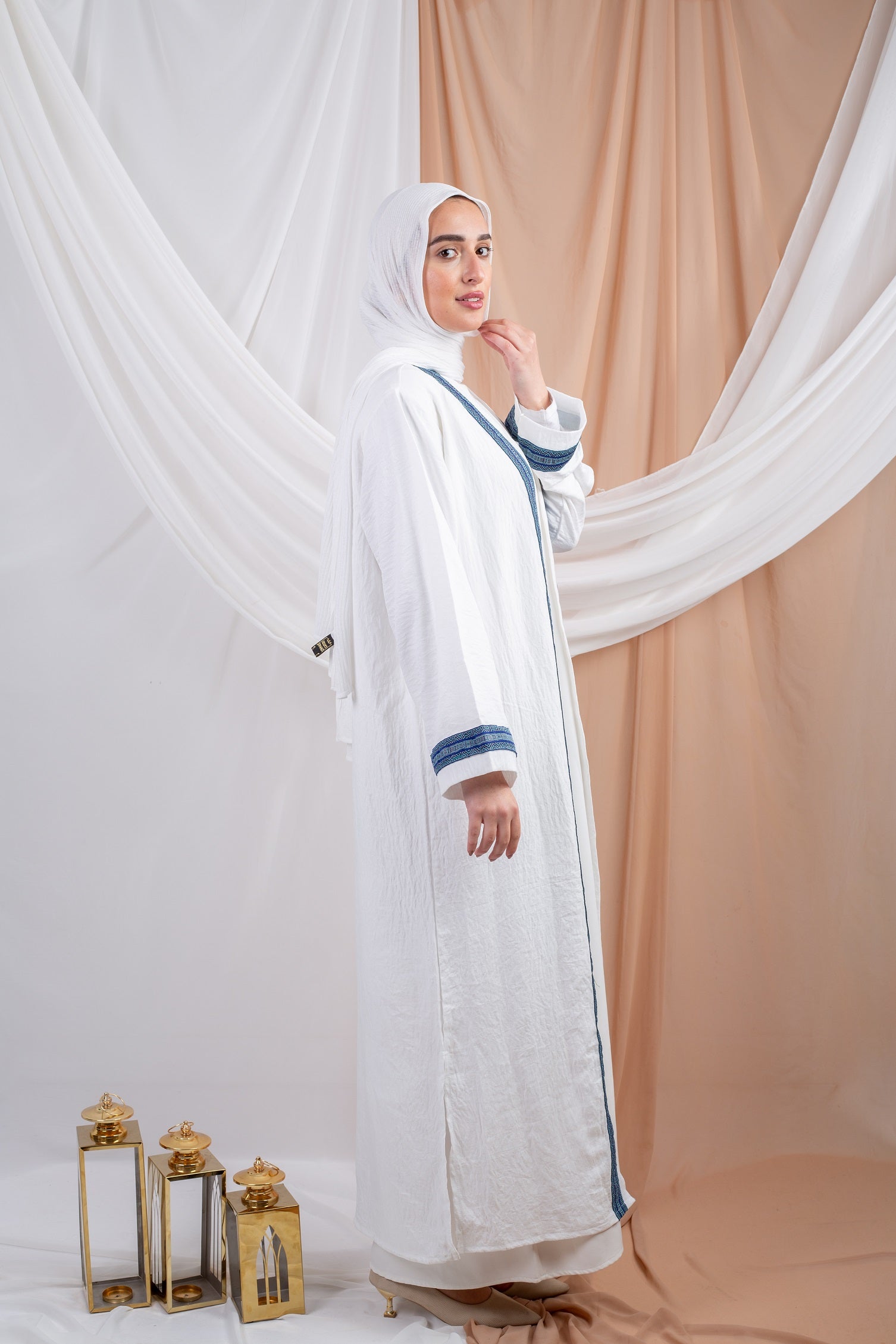 Siwa Kaftan Blue is a timeless piece crafted from breathable linen fabric, offering both comfort and sophistication