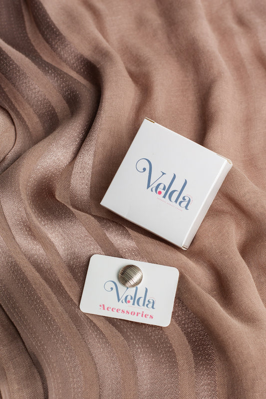 Space Magnetic Pin is a sleek and practical accessory designed for effortless style.  it securely attaches to any fabric without the need for pins or holes.