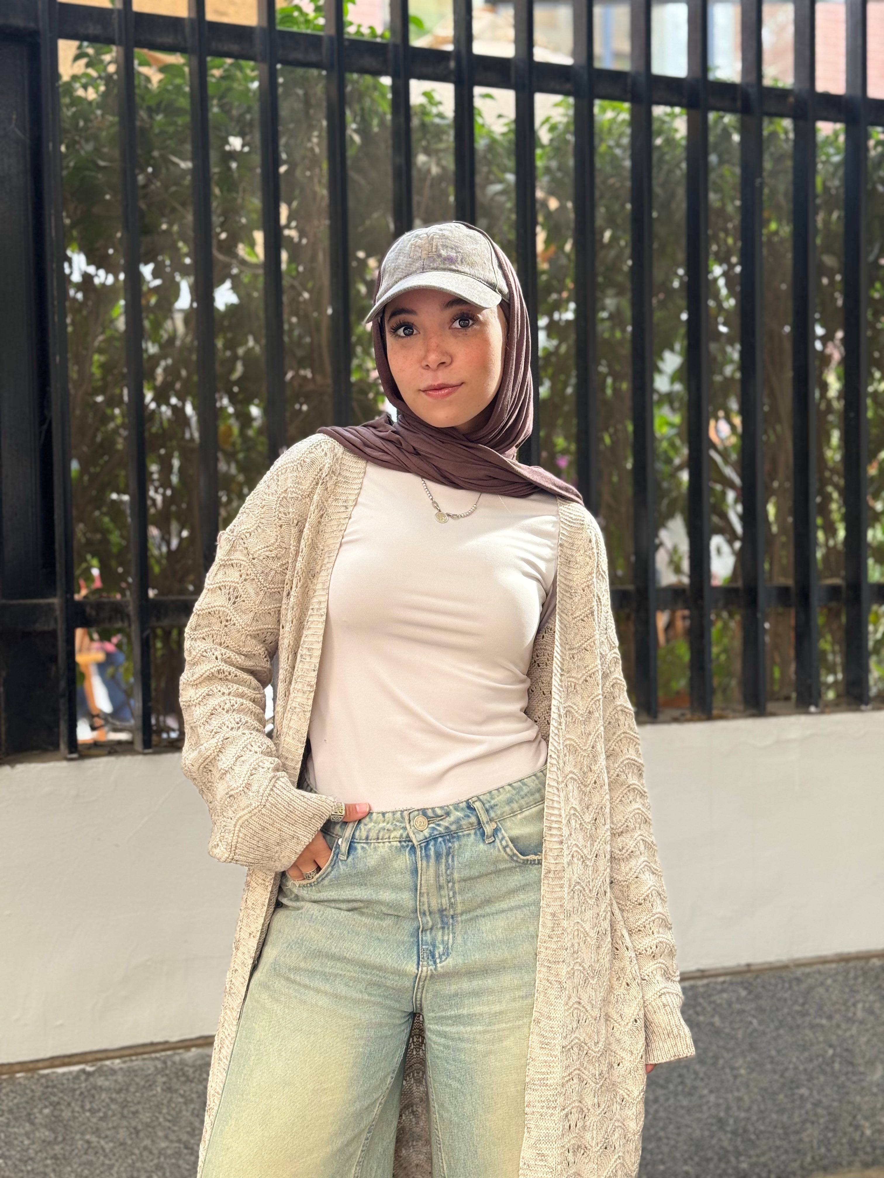 Stitchy Cardigan crafted from trico fabric, featuring long sleeves for a cozy and stylish look.