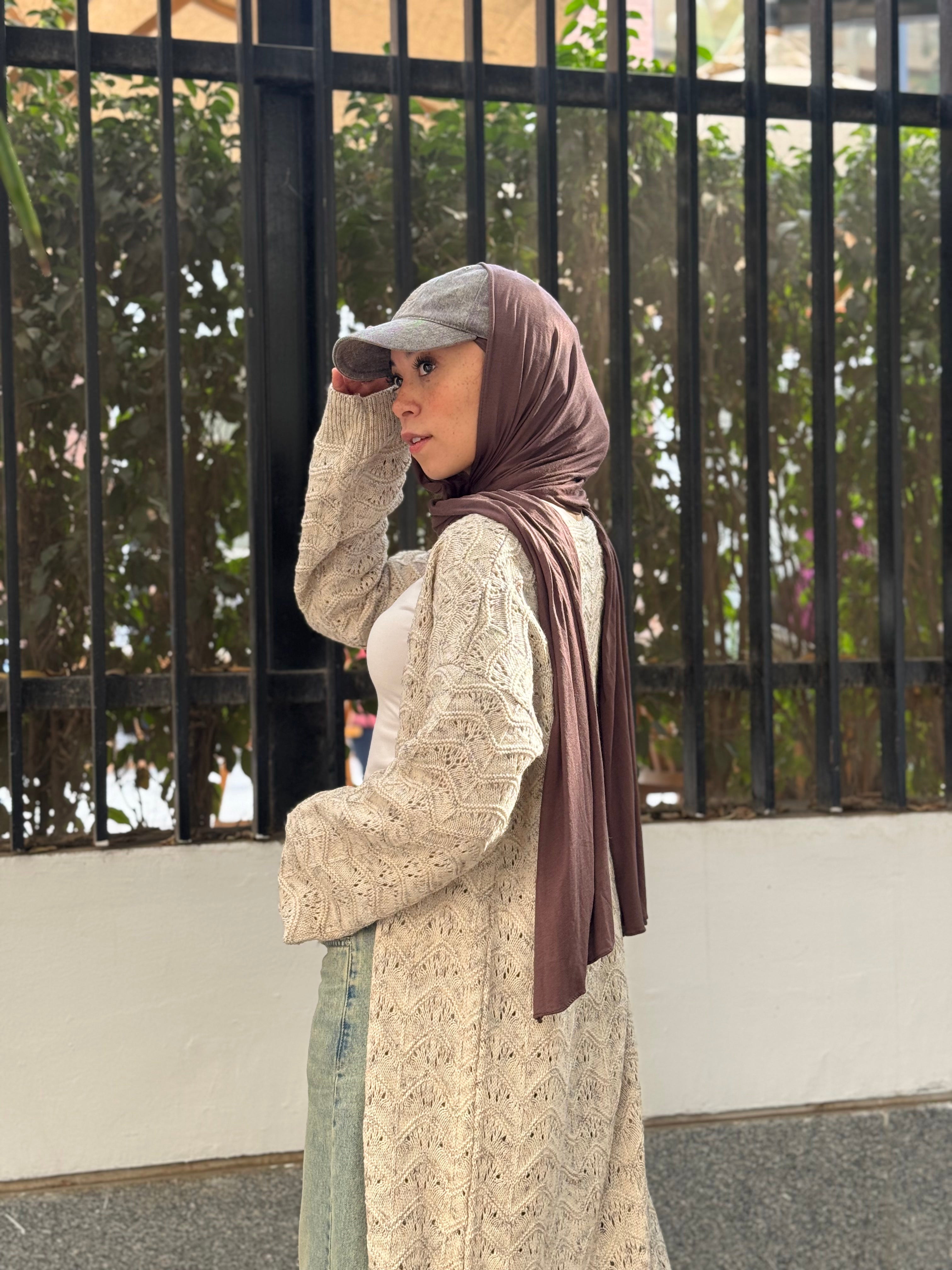 Stitchy Cardigan crafted from trico fabric, featuring long sleeves for a cozy and stylish look.