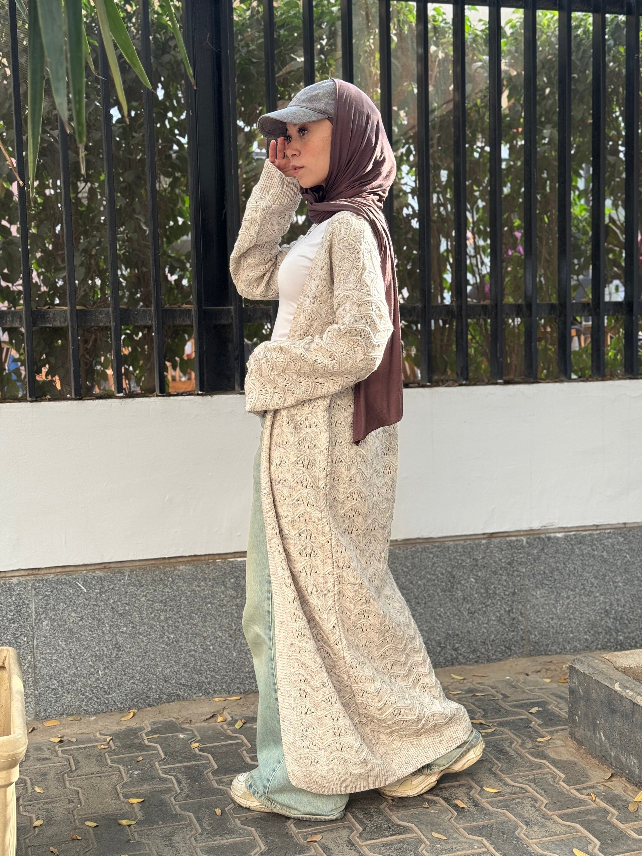 Stitchy Cardigan crafted from trico fabric, featuring long sleeves for a cozy and stylish look.