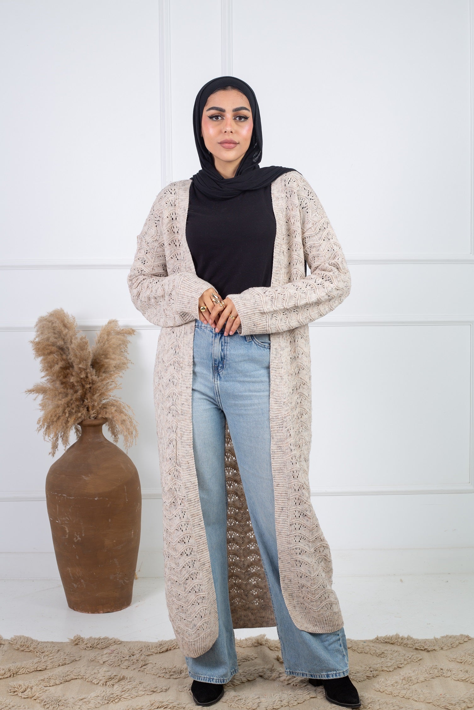 Stitchy Cardigan crafted from trico fabric, featuring long sleeves for a cozy and stylish look.