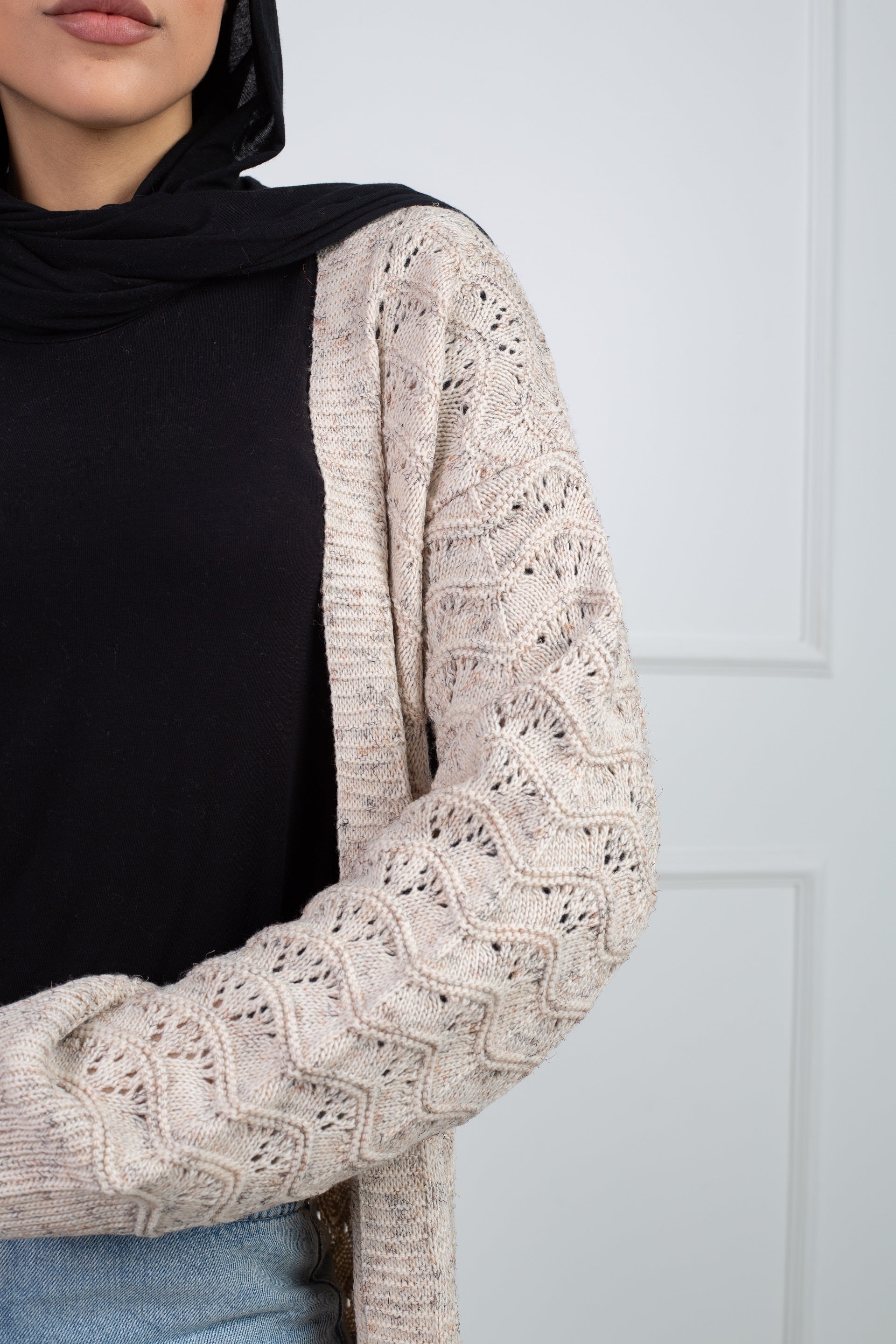 Stitchy Cardigan crafted from trico fabric, featuring long sleeves for a cozy and stylish look.