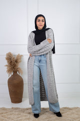 Stitchy Cardigan Gray crafted from trico fabric, featuring long sleeves for a cozy and stylish look.