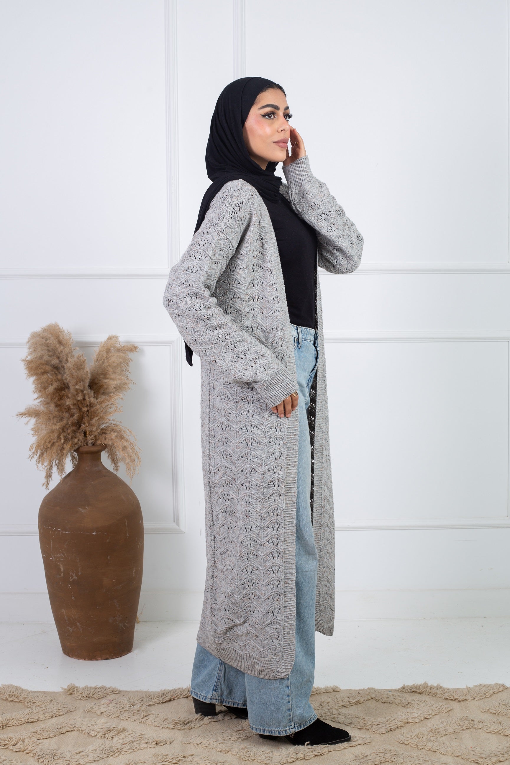 Stitchy Cardigan Gray crafted from trico fabric, featuring long sleeves for a cozy and stylish look.