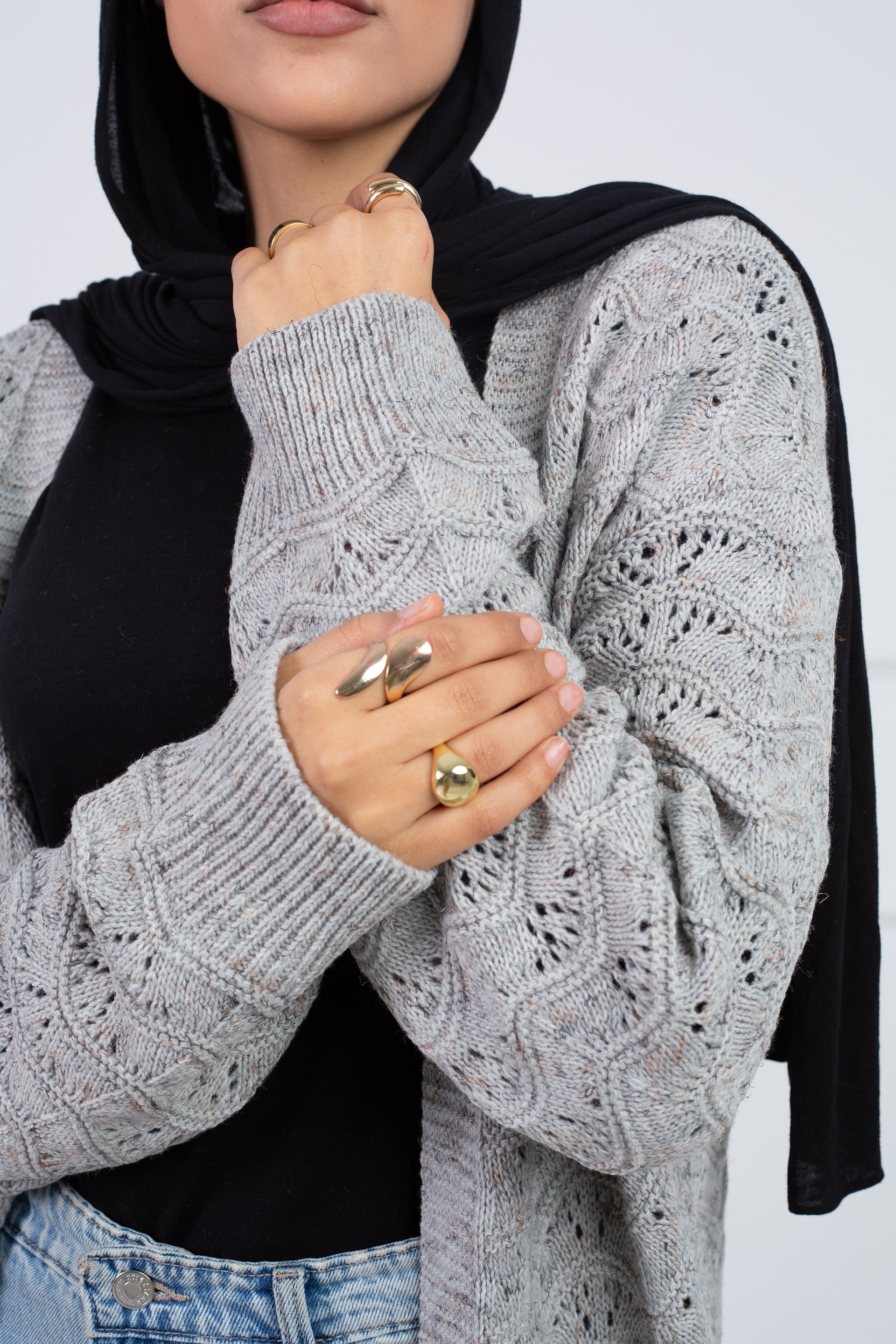 Stitchy Cardigan Gray crafted from trico fabric, featuring long sleeves for a cozy and stylish look.