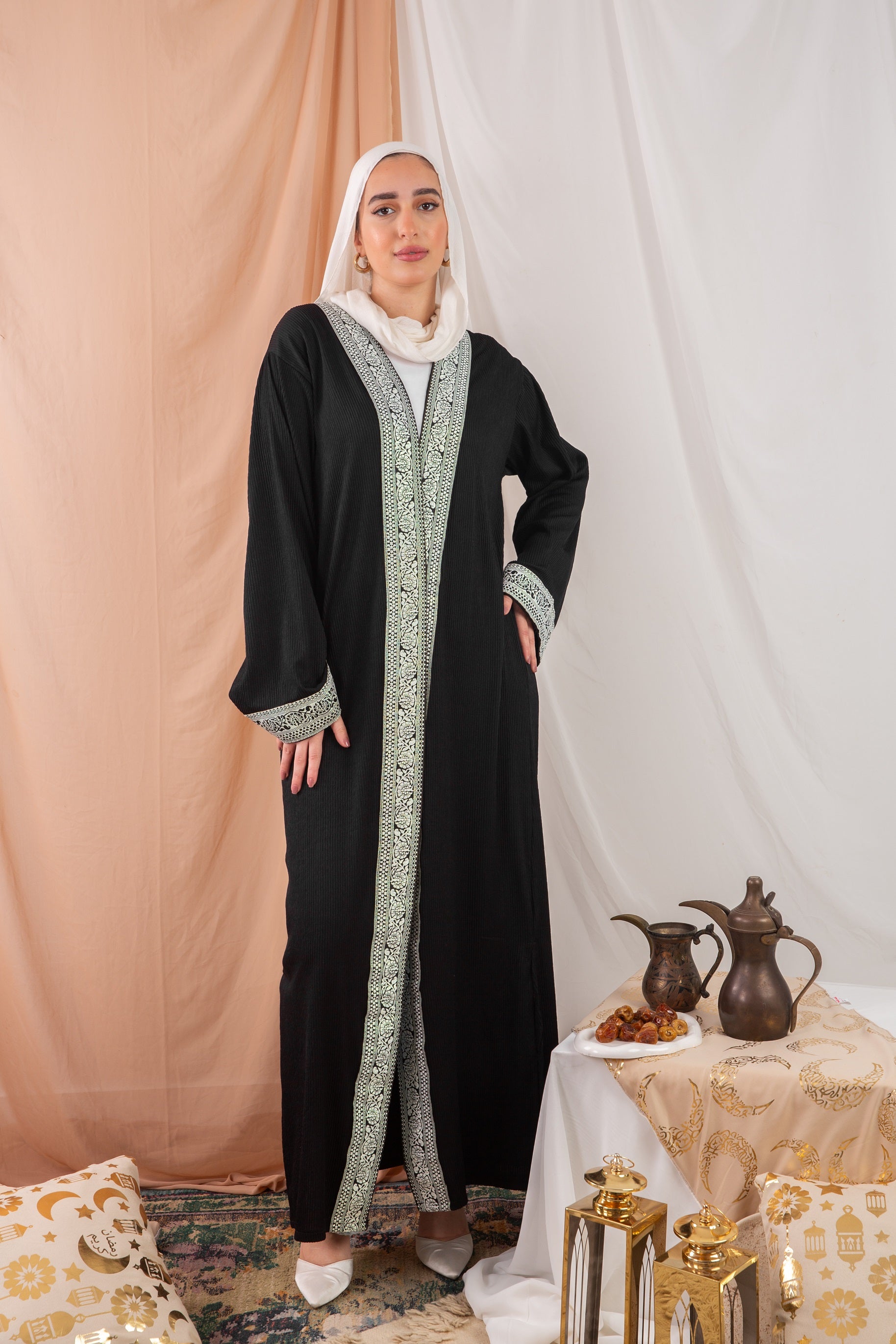 Zekra_Kaftan_Black crafted from crinkle rib-knitted fabric, offers a blend of texture and elegance for a timeless look