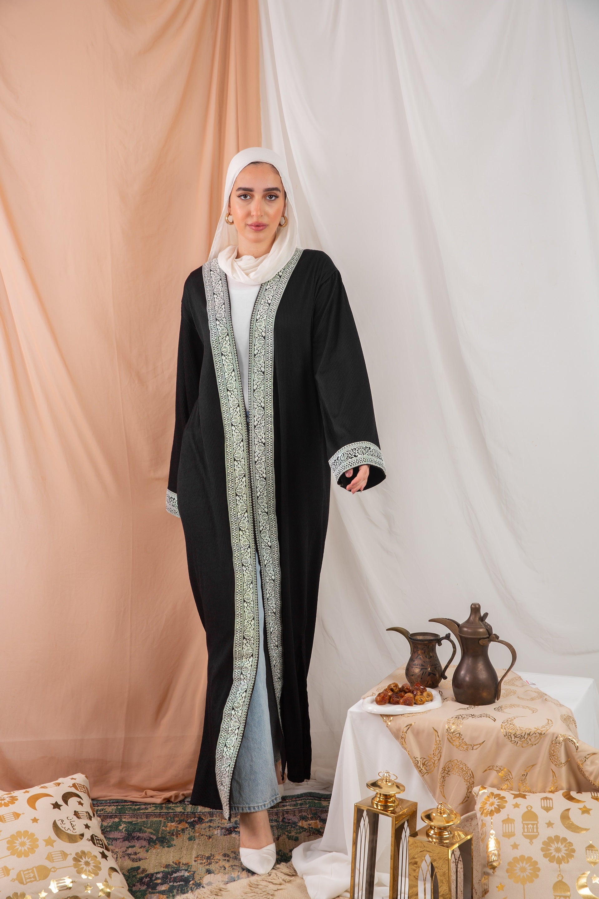 Zekra_Kaftan_Black 2 crafted from crinkle rib-knitted fabric, offers a blend of texture and elegance for a timeless look