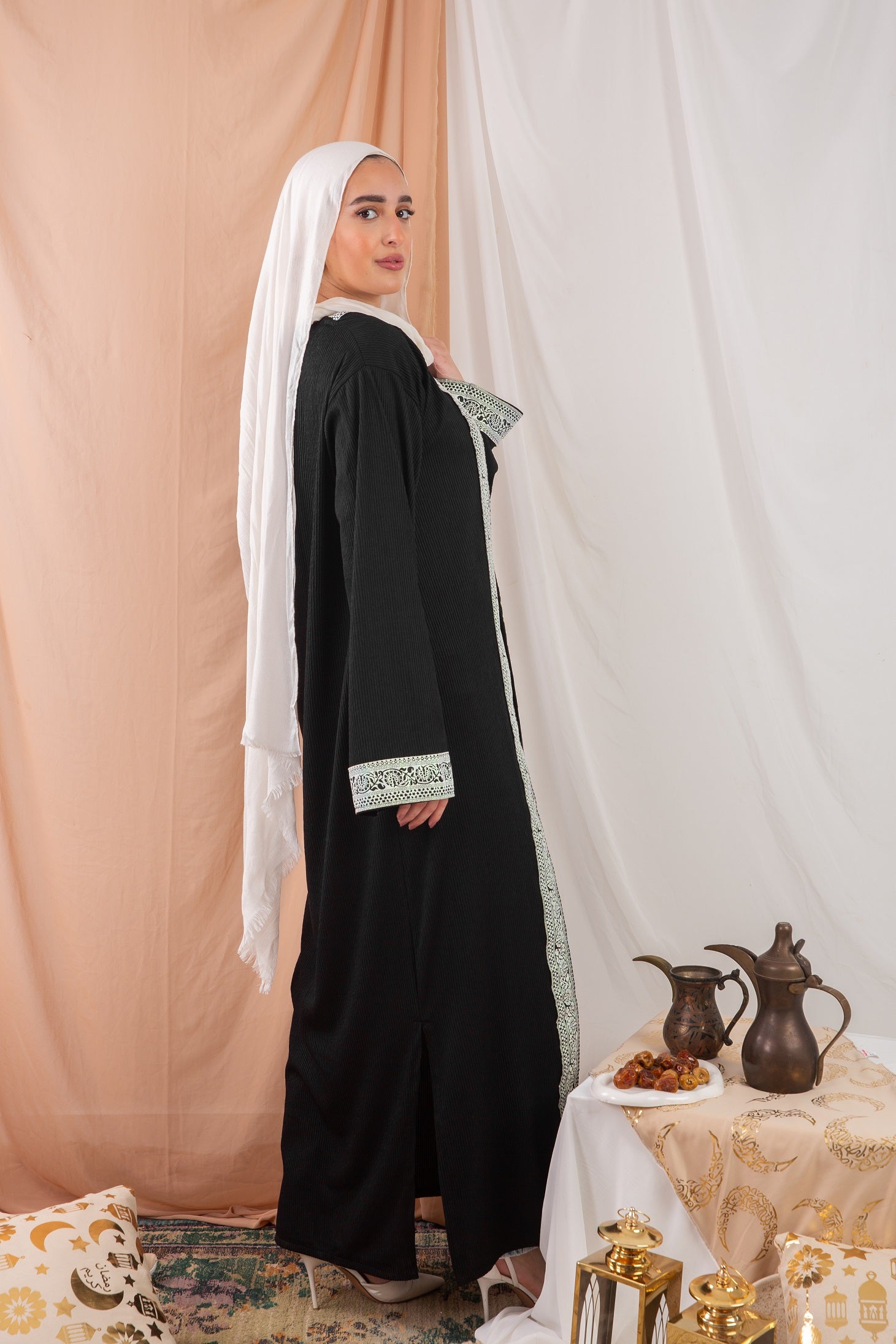 Zekra_Kaftan_Black 3 crafted from crinkle rib-knitted fabric, offers a blend of texture and elegance for a timeless look