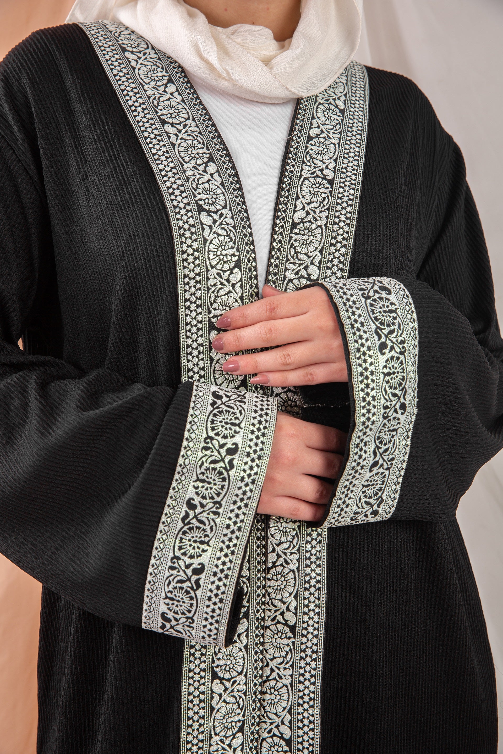 Zekra_Kaftan_Black 5 crafted from crinkle rib-knitted fabric, offers a blend of texture and elegance for a timeless look