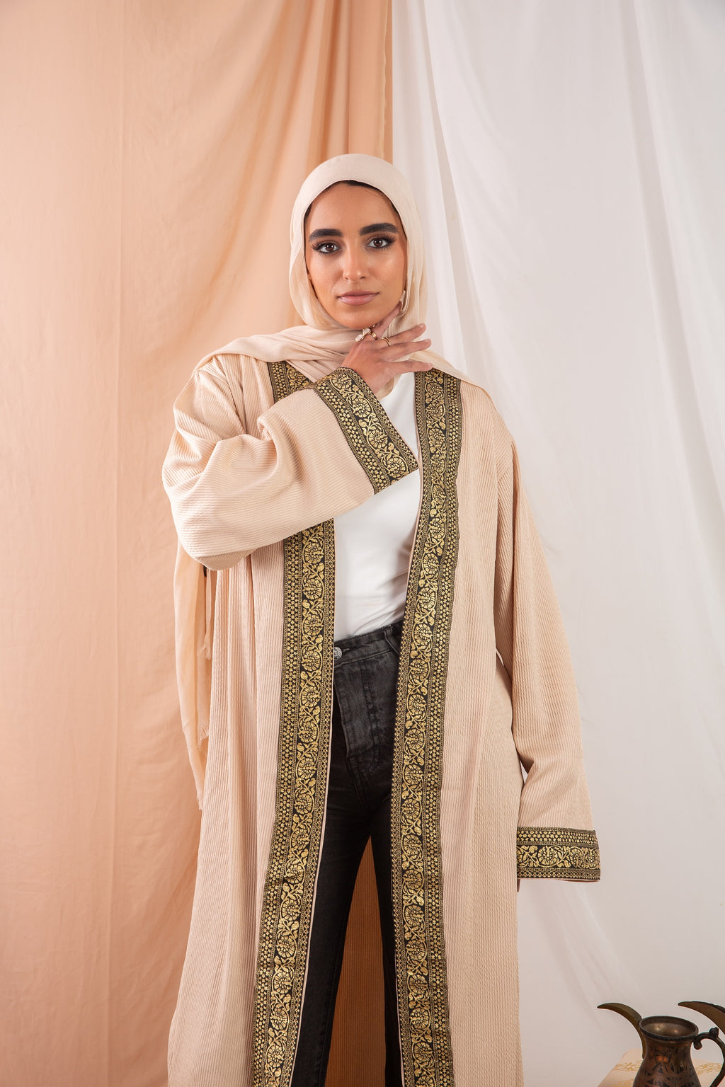 Zekra_Kaftan Dark Beige 3 crafted from crinkle rib-knitted fabric, offers a blend of texture and elegance for a timeless look