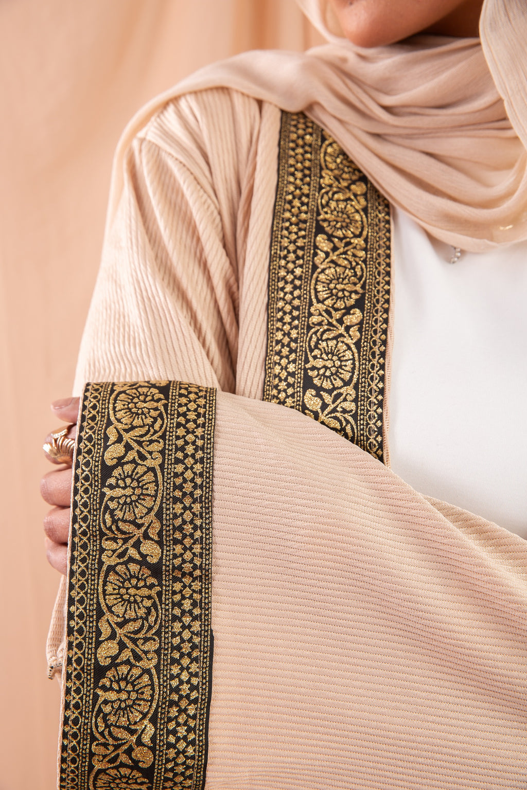 Zekra_Kaftan Dark Beige 4 crafted from crinkle rib-knitted fabric, offers a blend of texture and elegance for a timeless look