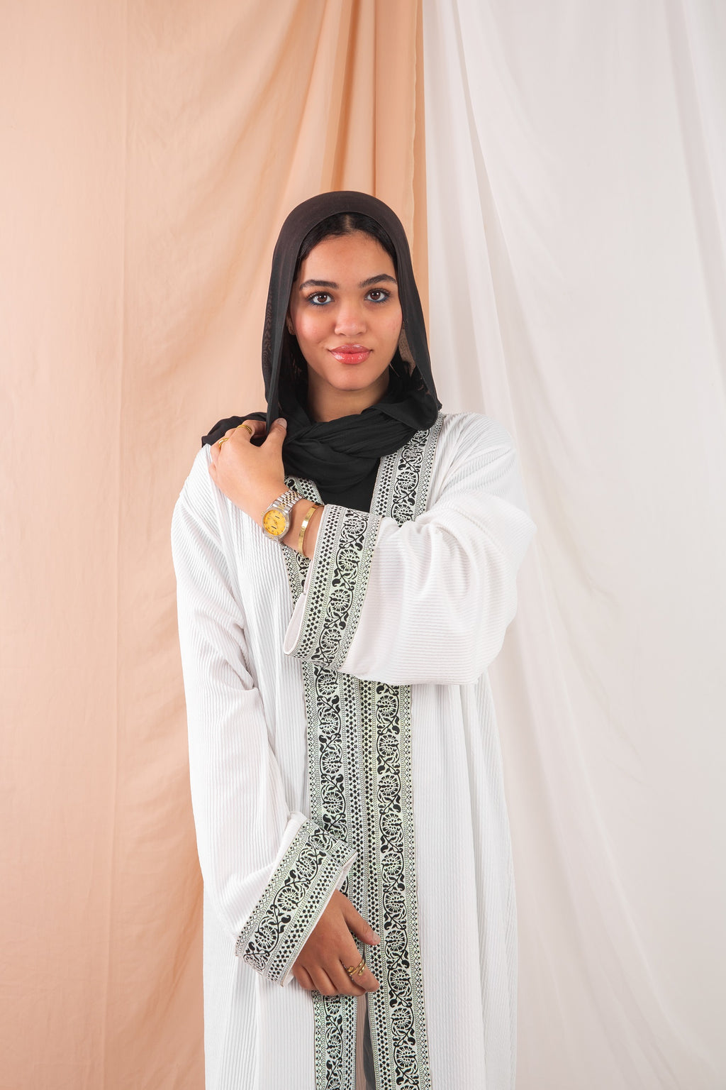Zekra_Kaftan_White  1 crafted from crinkle rib-knitted fabric, offers a blend of texture and elegance for a timeless look