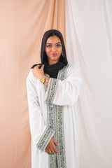 Zekra_Kaftan_White  1 crafted from crinkle rib-knitted fabric, offers a blend of texture and elegance for a timeless look